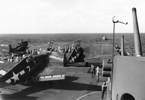 F6F Hellcat – Air Group 16 USS Lexington (CV-16) F6F-3 Hellcat Air Group 16 in tricolor variant aboard USS Lexington CV-16 with pilots before the mission