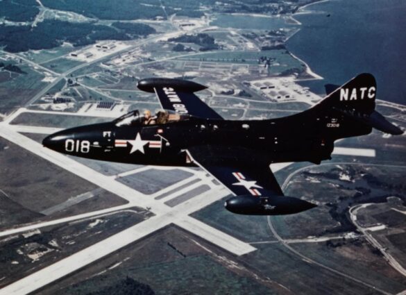 Grumman F9F 2 Panther in flight over Naval Air Station Patuxent River in the 1950s NH 101804 KN