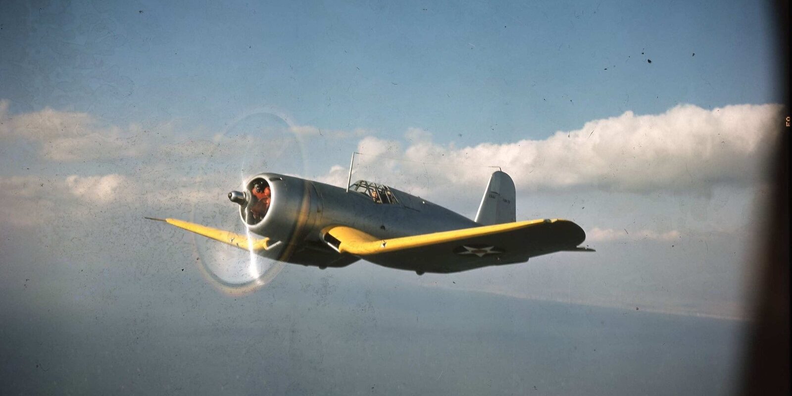 Vought-Sikorsky XF4U-1 Corsair prototype Bu.No.1443 side profile during early flight testing, showing forward cockpit position and prototype tail hook configuration