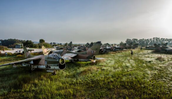 Weathered Hellenic Air Force A-7E Corsair cemetery model with faded camouflage and open maintenance panels.