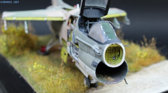Weathered Hellenic Air Force A-7E Corsair cemetery model with faded camouflage and open maintenance panels.