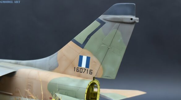 Weathered Hellenic Air Force A-7E Corsair cemetery model with faded camouflage and open maintenance panels.