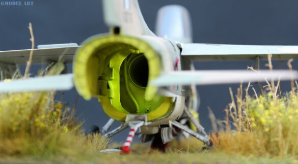Weathered Hellenic Air Force A-7E Corsair cemetery model with faded camouflage and open maintenance panels.