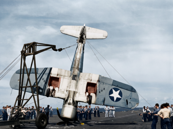 Line of VF-17 F4U-1 Birdcage Corsair fighters displaying different camouflage and production variations