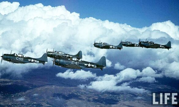 Weathered Douglas SBD Dauntless White C 46 showing faded Blue Gray camouflage and replacement cowling during a training flight.