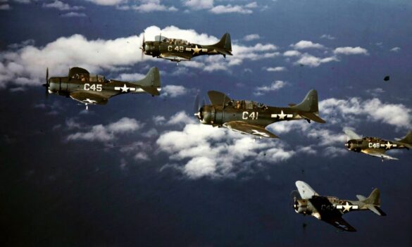 Weathered Douglas SBD Dauntless White C 46 showing faded Blue Gray camouflage and replacement cowling during a training flight.