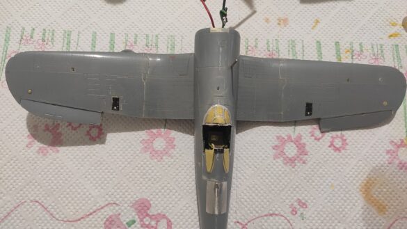 Detailed 1:48 scale F4U-1 Corsair Birdcage model representing VF-17 17-F-31, built with Tamiya, Aires, ICM and Eduard components and displayed on a U.S. Navy aircraft carrier deck.