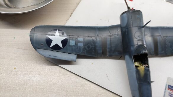 Detailed 1:48 scale F4U-1 Corsair Birdcage model representing VF-17 17-F-31, built with Tamiya, Aires, ICM and Eduard components and displayed on a U.S. Navy aircraft carrier deck.
