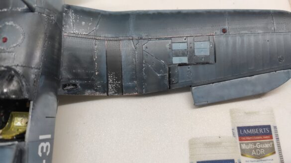 Detailed 1:48 scale F4U-1 Corsair Birdcage model representing VF-17 17-F-31, built with Tamiya, Aires, ICM and Eduard components and displayed on a U.S. Navy aircraft carrier deck.