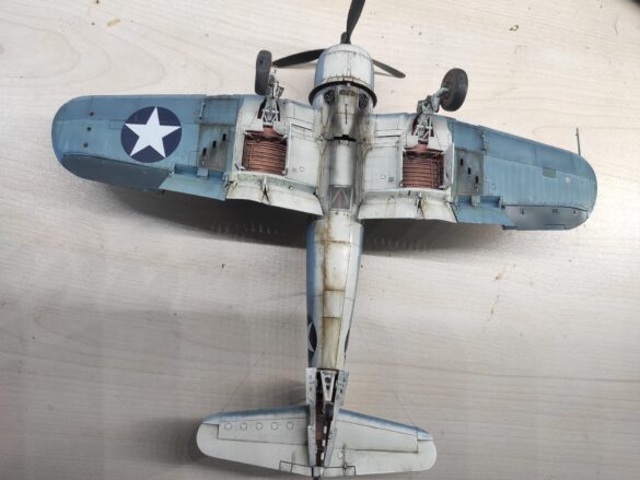 Detailed 1:48 scale F4U-1 Corsair Birdcage model representing VF-17 17-F-31, built with Tamiya, Aires, ICM and Eduard components and displayed on a U.S. Navy aircraft carrier deck.