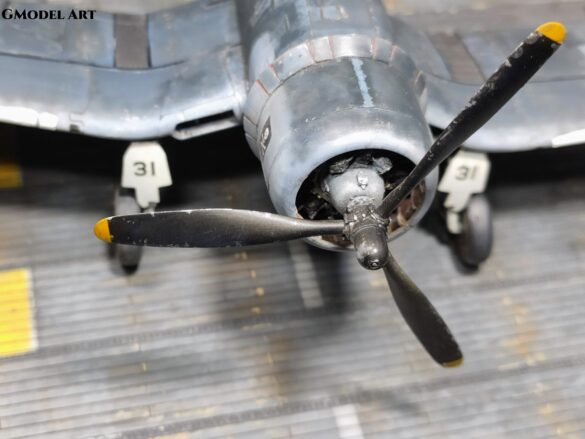 Detailed 1:48 scale F4U-1 Corsair Birdcage model representing VF-17 17-F-31, built with Tamiya, Aires, ICM and Eduard components and displayed on a U.S. Navy aircraft carrier deck.