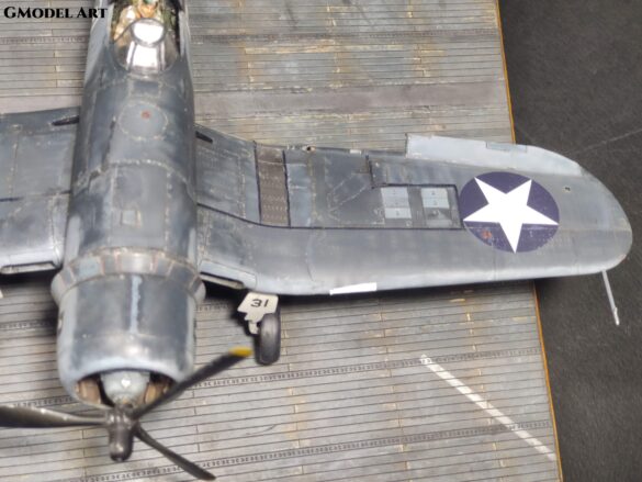 Detailed 1:48 scale F4U-1 Corsair Birdcage model representing VF-17 17-F-31, built with Tamiya, Aires, ICM and Eduard components and displayed on a U.S. Navy aircraft carrier deck.