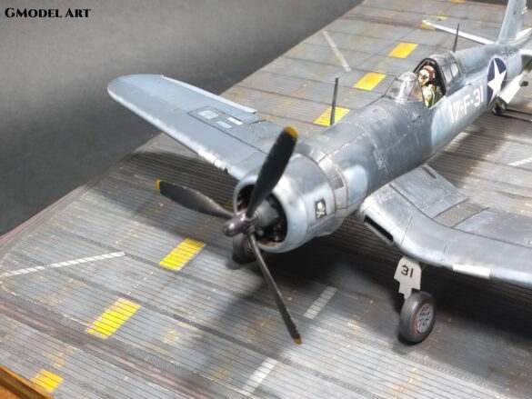 Detailed 1:48 scale F4U-1 Corsair Birdcage model representing VF-17 17-F-31, built with Tamiya, Aires, ICM and Eduard components and displayed on a U.S. Navy aircraft carrier deck.