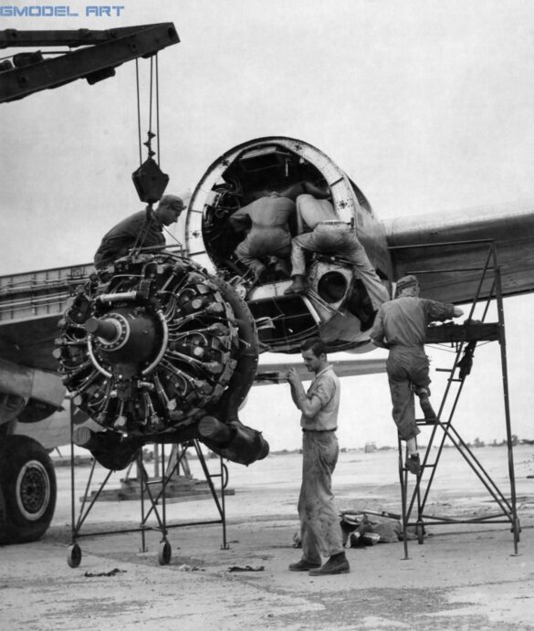 Boeing B-29 Superfortress in the Pacific – WWII History & Scale Modeling Guide 53912 A.C. - India Sgt Guy D. Cutter, Detroit, MI, left, and Cpl David Marks, Cincinnati, OH, guide a damaged engine of a Boeing B-29 Superfortress to the ground while three mechanics inspect the engine casing. (Credit photo to the National Museum of the USAF)
