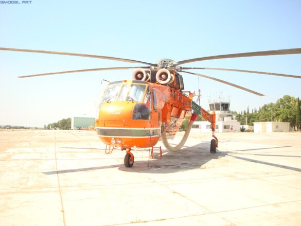 Firefighting water tank mounted beneath the fuselage of a Sikorsky S-64 Skycrane.