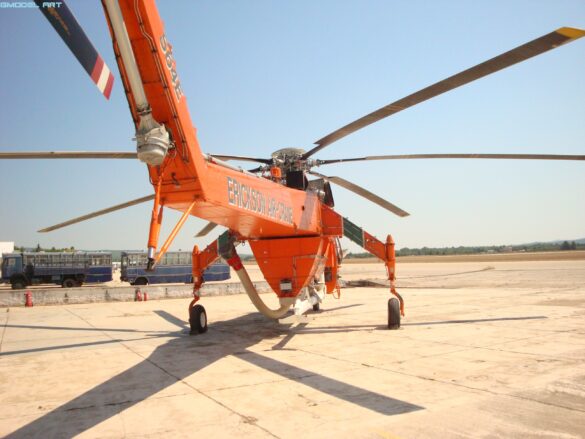 Sikorsky S-64 Skycrane collecting water using its firefighting snorkel.