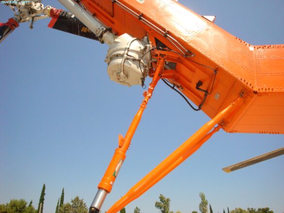 Firefighting water tank mounted beneath the fuselage of a Sikorsky S-64 Skycrane.