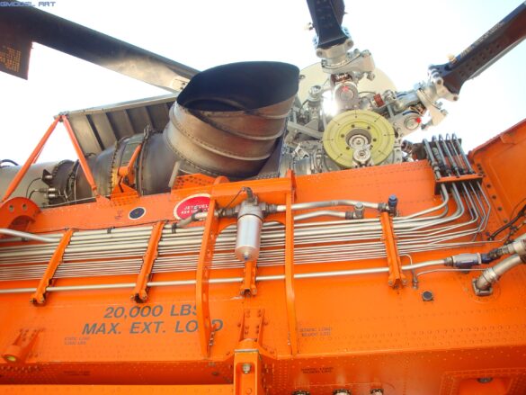 Firefighting water tank mounted beneath the fuselage of a Sikorsky S-64 Skycrane.