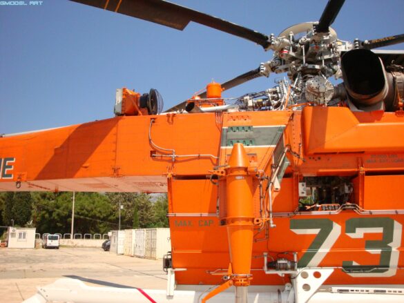 Sikorsky S-64 Skycrane firefighting helicopter operating during wildfire suppression in Greece.
