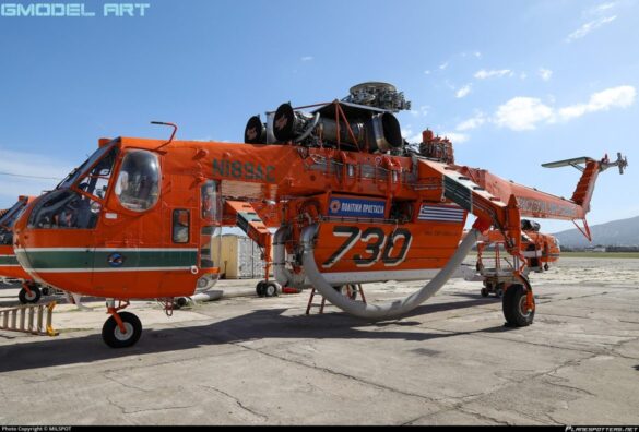 Firefighting water tank mounted beneath the fuselage of a Sikorsky S-64 Skycrane.