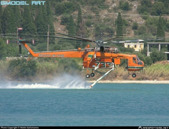Sikorsky S-64 Skycrane collecting water using its firefighting snorkel.