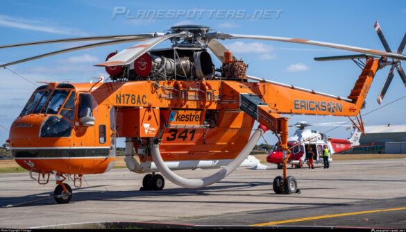 Sikorsky S-64 Skycrane collecting water using its firefighting snorkel.