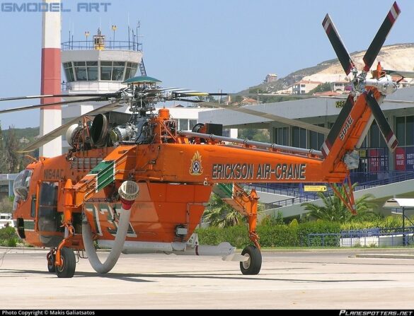 Sikorsky S-64 Skycrane collecting water using its firefighting snorkel.