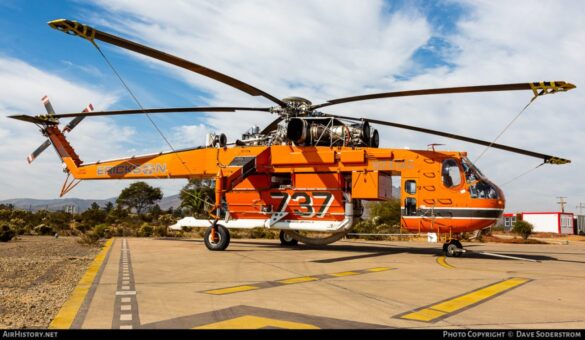 Sikorsky S-64 Skycrane firefighting helicopter operating during wildfire suppression in Greece.