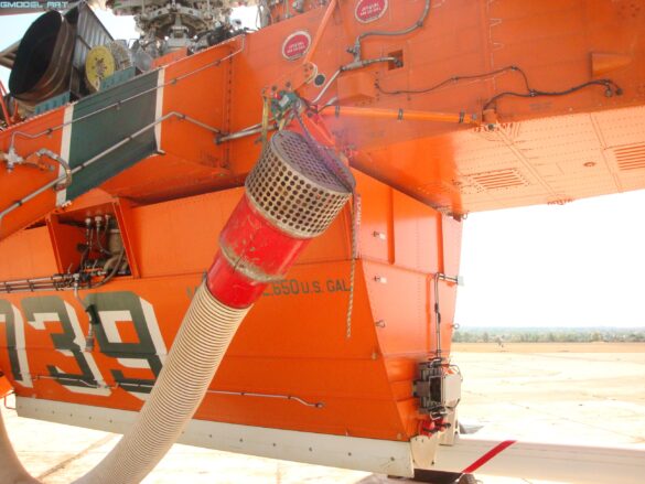 Sikorsky S-64 Skycrane firefighting helicopter operating during wildfire suppression in Greece.