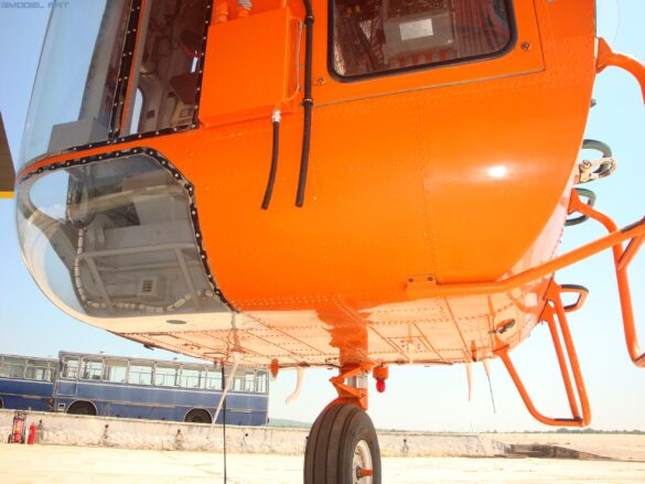 Sikorsky S-64 Skycrane in flight showing its open-frame fuselage and six-blade main rotor.