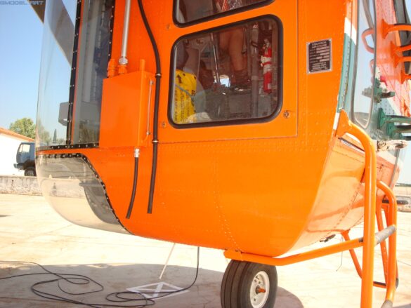 Sikorsky S-64 Skycrane in flight showing its open-frame fuselage and six-blade main rotor.